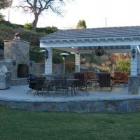 Backyard patio with fireplace and table