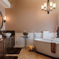 bathroom with wood sink and detached tub